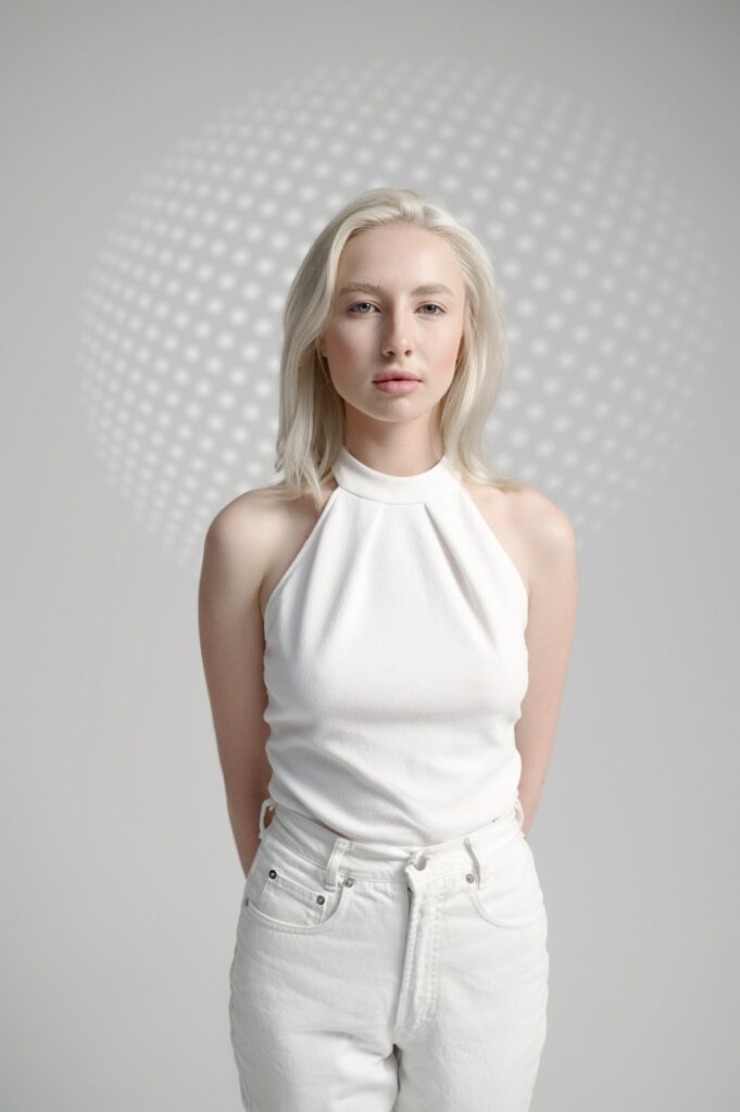 Futuristic young woman in white clothes